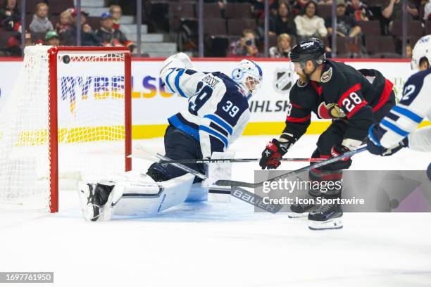 Winnipeg Jets Goalie Laurent Brossoit allows a goal by Ottawa Senators Right Wing Claude Giroux during second period National Hockey League action...