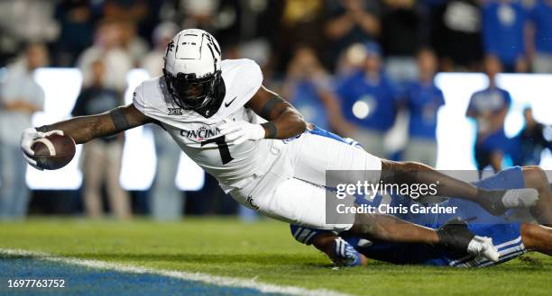 Chamon Metayer of the Cincinnati Bearcats dives to score a touchdown against the Brigham Young Cougars during the first half of their game at LaVell...