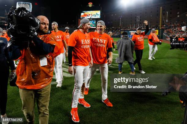 Heston Kjerstad of the Baltimore Orioles celebrates with Gunnar Henderson after defeating the Boston Red Sox to win the American League East at...