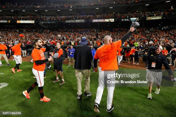 Members of the Baltimore Orioles celebrate after defeating the Boston Red Sox to win the American League East at Oriole Park at Camden Yards on...