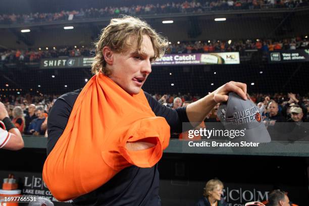 Gunnar Henderson of the Baltimore Orioles celebrates on the field after the Orioles defeated the Boston Red Sox to win the American League East at...