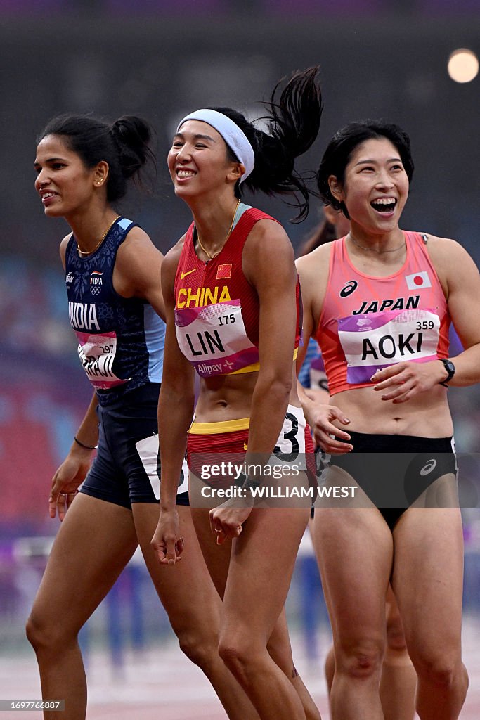 Lin Yuwei Sprinter China's Lin Yuwei reacts with India's Jyothi Yarraji and Japan's ...