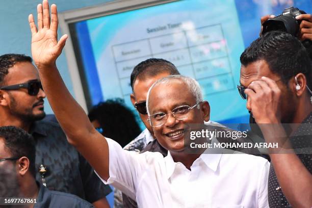 Ibrahim Mohamed Solih , the incumbent Maldives President, waves after casting his ballot at a polling station during the second round of Maldives'...