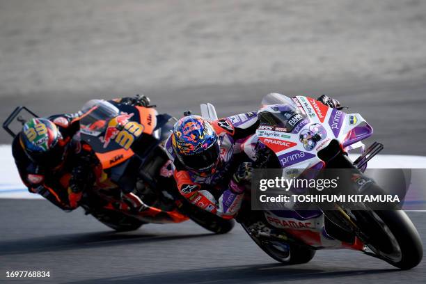 Prima Pramac Racing rider Jorge Martin of Spain leads Red Bull KTM Factory Racing rider Brad Binder of South Africa during the sprint race of MotoGP...