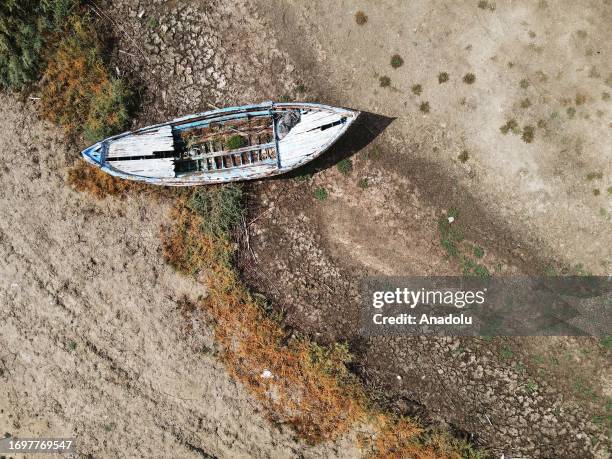 An aerial view of a boat on dried Lake Bafa, as the water recedes by about 20 meters due to climate change as a result of the drop in precipitation,...