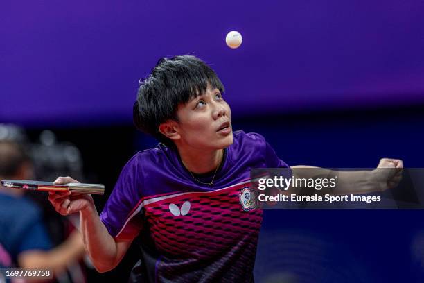 Cheng I-ching of Taiwan competes against Hina Hayata of Japan in their women's singles quarter-final table tennis match during the 2022 Asian Games...