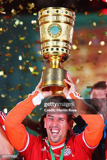 Franck Ribery of Bayern Muenchen lifts the trophy to celebrate victory after the DFB Cup Final match between FC Bayern Muenchen and VfB Stuttgart at...