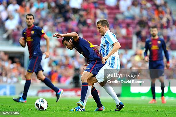 Pedro Rodriguez of FC Barcelona duels for the ball with Ignacio Camacho of Malaga CF during the La Liga match between FC Barcelona and Malaga CF at...