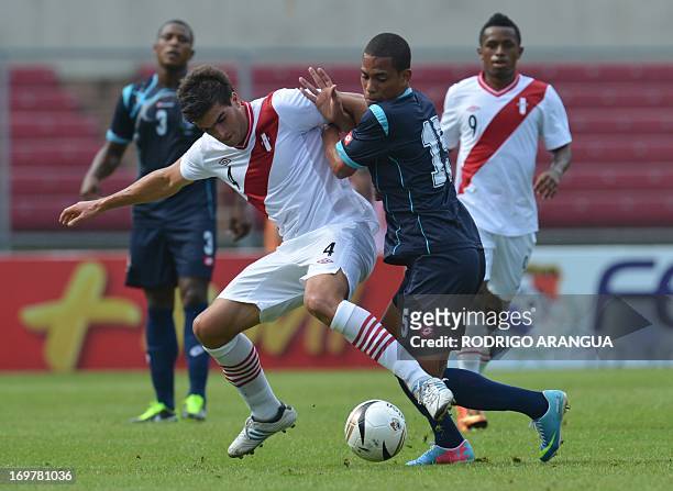 Panama's Jairo Jimenez viewsfor the ball with Alvaro Ampuero of Peru, during their friendly football match at the Rommel Fernandez stadium, in Panama...