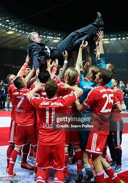 Jupp Heynckes head coach of Bayern Muenchen celebrates victory with his players in his last match after the DFB Cup Final match between FC Bayern...