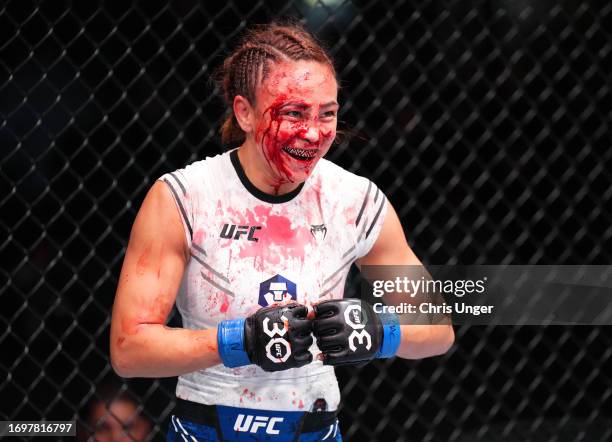 Michelle Waterson-Gomez smiles during a strawweight fight against Marina Rodriguez of Brazil during the UFC Fight Night event at UFC APEX on...