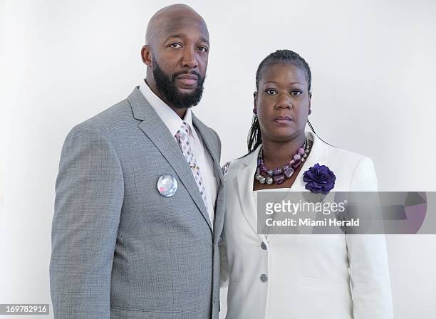 Tracy Martin, left, and Sybrina Fulton, parents of slain teenager Trayvon Martin, before the start of the Community Program of Peace, Justice and...