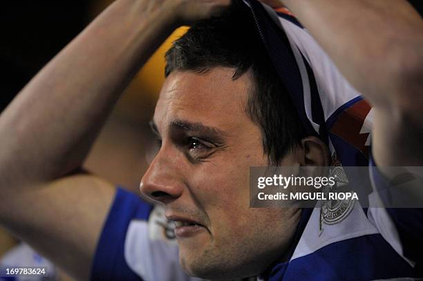 Deportivo Coruna's supporters cries after the Spanish league football match Deportivo Coruna vs Real Sociedad at Riazor stadium in Coruna, on June 1,...