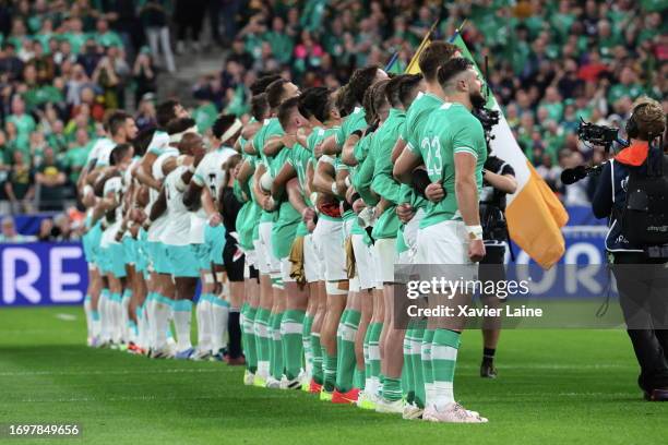 Robbie Henshaw of Ireland pose with teammates befor the Rugby World Cup France 2023 match between South Africa and Ireland at Stade de France on...