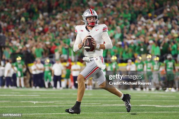 Kyle McCord of the Ohio State Buckeyes looks to pass against the Notre Dame Fighting Irish during the first half at Notre Dame Stadium on September...