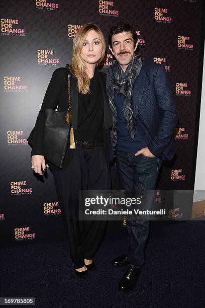 Anna Ferzetti and actor Pierfrancesco Favino arrive at the Royal Box photo wall ahead of the "Chime For Change: The Sound Of Change Live" Concert at...