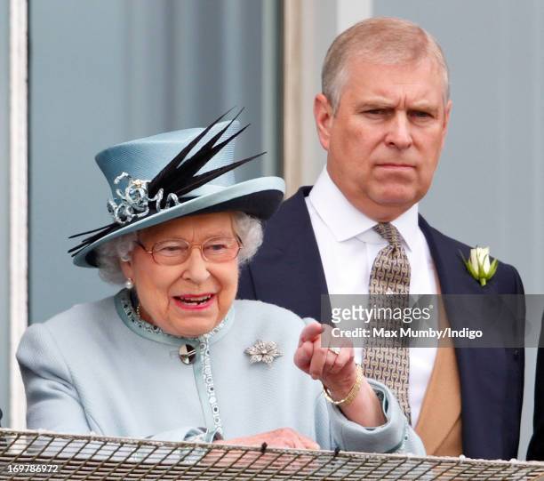 Queen Elizabeth II and Prince Andrew, Duke of York watch the racing as they attend Derby Day of the Investec Derby Festival at Epsom Racecourse on...