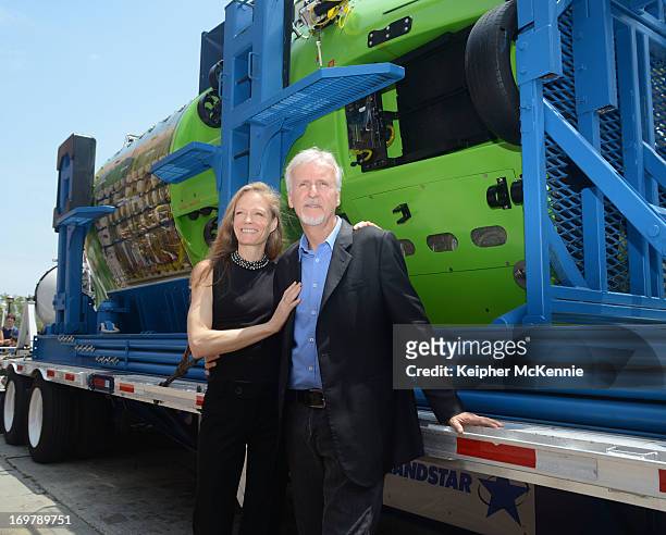 Suzy Amis Cameron and director James Cameron pose for pictures with Deepsea Challenger at California Science Center on June 1, 2013 in Los Angeles,...