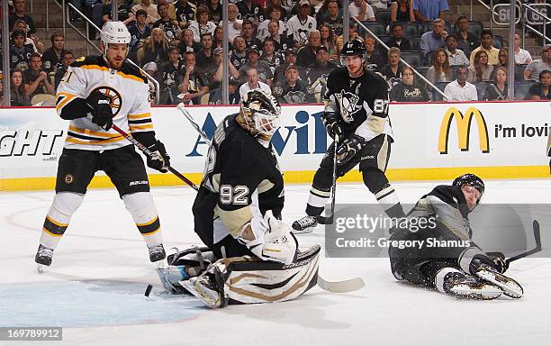 Tomas Vokoun of the Pittsburgh Penguins can't stop a shot by David Krejci of the Boston Bruins in front of Paul Martin in Game One of the Eastern...