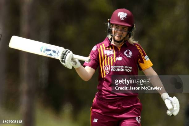 Georgia Redmayne of the Fire celebrates after reaching their half century during the WNCL match between New South Wales Breakers and Queensland Fire...