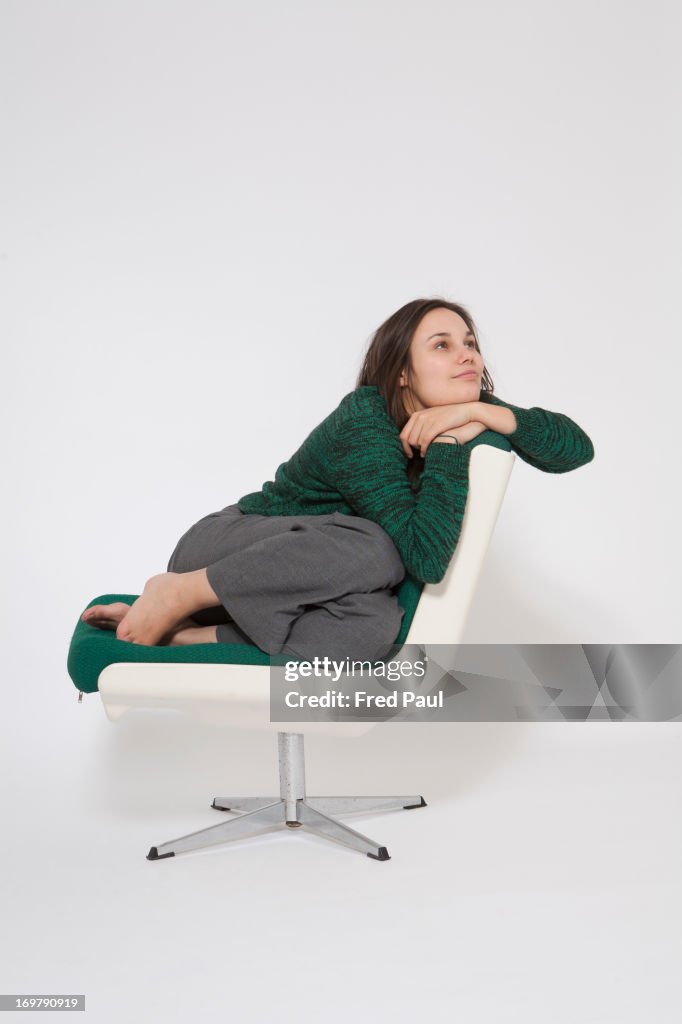 Young woman dreaming on a chair