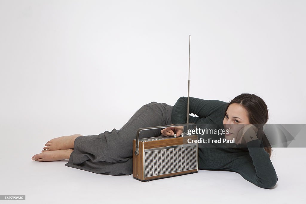 Young woman listening to the radio