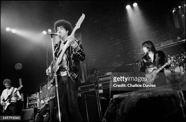 Phil Lynott and Scott Gorham of Thin Lizzy and the band's original guitarist Eric Bell rehearse with Snowy Whit and Darren Wharton during a...
