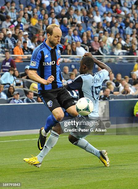 Mid-fielder Justin Mapp of the Montreal Impact makes a play on the ball against mid-fielder Peterson Joseph of Sporting Kansas City during the first...