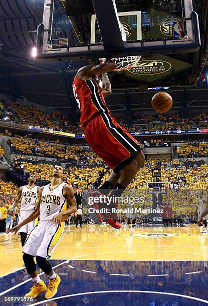 LeBron James of the Miami Heat dunks the ball against George Hill of the Indiana Pacers in Game Six of the Eastern Conference Finals during the 2013...