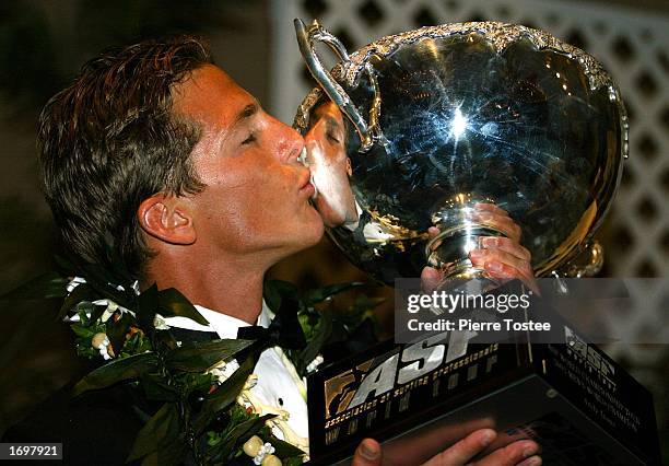 Andy Irons of the USA celebrates as he is crowned ASP World Champion at the Hilton Hawaiian Resort in Honolulu, Hawaii, USA on December 20, 2002....