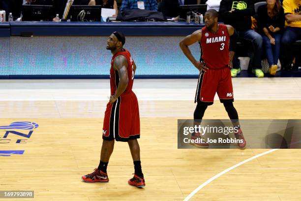 LeBron James of the Miami Heat walks to the bench after being taken out towards the end of the fourth period in Game Six of the Eastern Conference...