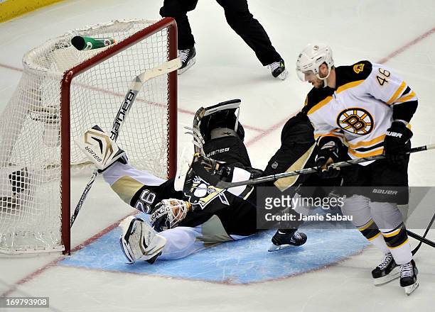 David Krejci of the Boston Bruins scores a goal on Tomas Vokoun of the Pittsburgh Penguins in the third period during Game One of the Eastern...