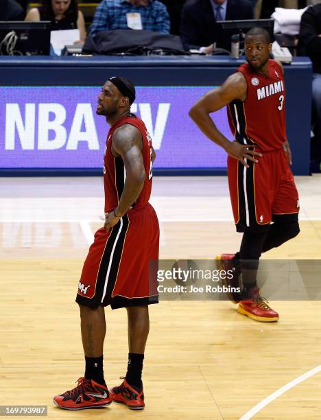 LeBron James of the Miami Heat walks to the bench after being taken out towards the end of the fourth period in Game Six of the Eastern Conference...