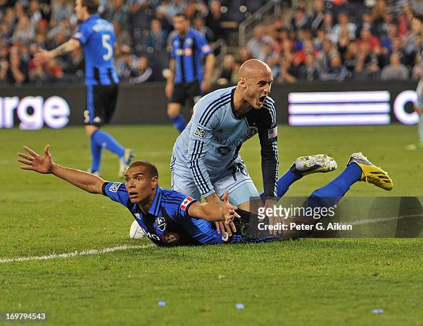 Defender Matteo Ferrari of the Montreal Impact reacts after a play against defender Aurelien Collin of Sporting Kansas City during the second half on...