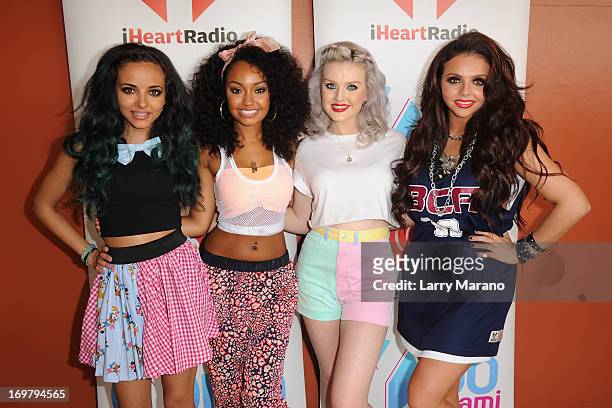 Jesy Nelson, Perrie Edwards, Jade Thirlwall and Leigh-Anne Pinnock of Little Mix pose backstage at Dolphin Mall on June 1, 2013 in Miami, Florida.