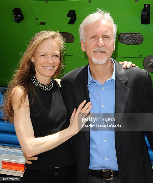 Director James Cameron and wife Suzy Amis attend the Deepsea Challenger photocall at California Science Center on June 1, 2013 in Los Angeles,...