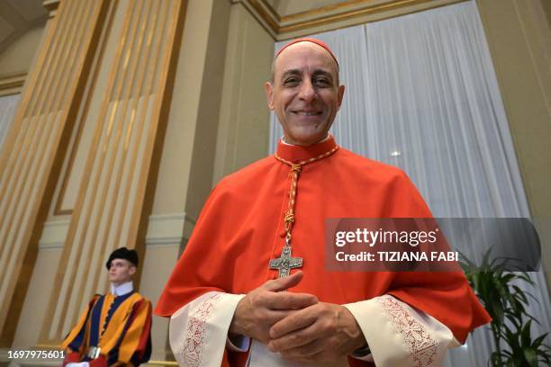 Newly elevated cardinal, Argentinian prelate Victor Manuel Fernandez, attends a courtesy visit of relatives following a consistory for the creation...