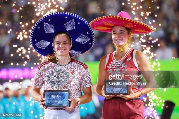 Maria Sakkari of Greece and Caroline Dolehide of United States pose with their trophies after the women's singles final match as part of the final...