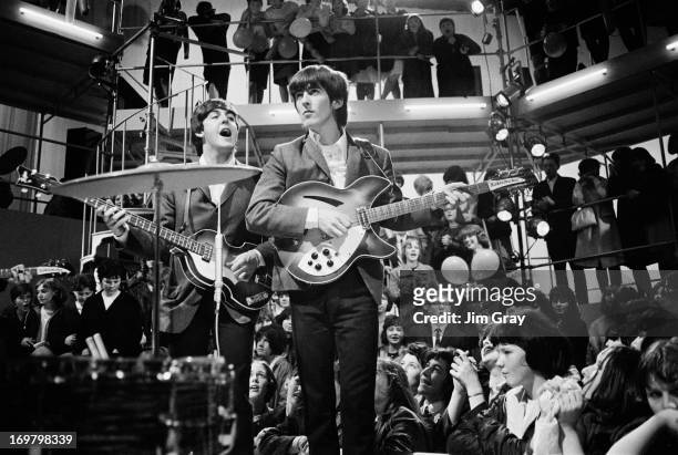 Paul McCartney and George Harrison , of The Beatles, performing at a rehearsal for the 'Round The Beatles' TV show at the Rediffusion TV studios in...