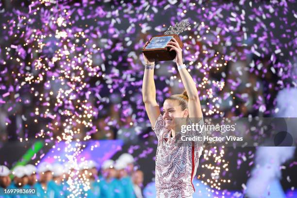 Maria Sakkari of Greece celebrates with the champion trophy after winning the women's singles final match against Caroline Dolehide of United States...