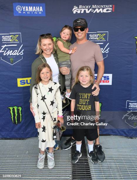 Beverley Mitchell and Michael Cameron with family attend the SuperMotocross World Championship Finals Celebrity Night at Los Angeles Memorial...