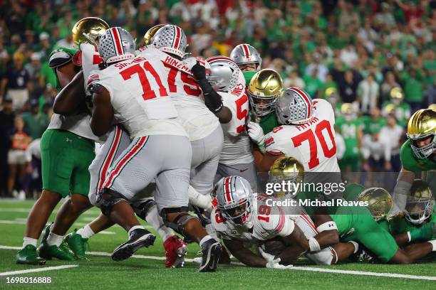 Chip Trayanum of the Ohio State Buckeyes scores a touchdown against the Notre Dame Fighting Irish during the fourth quarter at Notre Dame Stadium on...