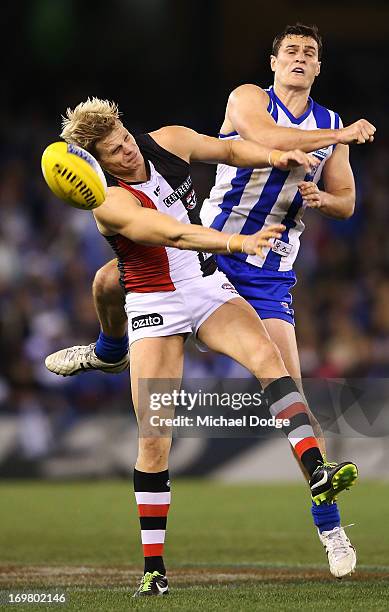 Nick Riewoldt of the Saints and Scott Thompson of the Kangaroos contest for the ball during the round ten AFL match between the North Melbourne...