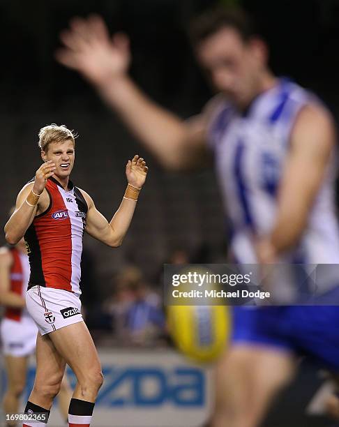 Nick Riewoldt of the Saints reacts as Todd Goldstein of the Kangaroos kicks the ball away during the round ten AFL match between the North Melbourne...