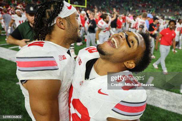 Emeka Egbuka and TreVeyon Henderson of the Ohio State Buckeyes celebrate after defeating the Notre Dame Fighting Irishat Notre Dame Stadium on...