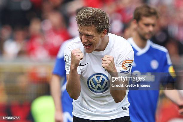 Andreas Mayer of Kassel celebrates his team's first goal during the Regionalliga Playoff Second Leg match between Hessen Kassel and Holstein Kiel at...