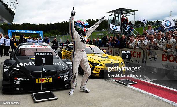 Bruno Spengler of Canada and BMW Team Schnitzer celebrates after winning the third round of the DTM 2013 German Touring Car Championship at Red Bull...