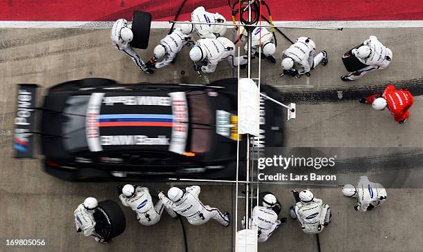 Bruno Spengler of Canada and BMW Team Schnitzer makes a pit stop during the third round of the DTM 2013 German Touring Car Championship at Red Bull...