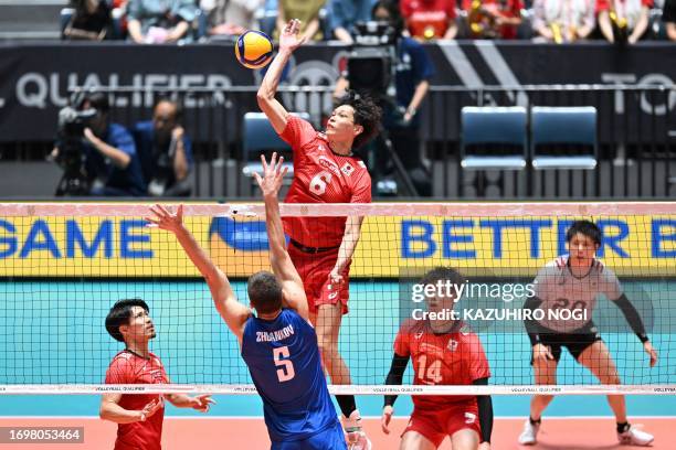 Japan's Akihiro Yamauchi spikes the ball during the match between Japan and Finland in the Volleyball World Cup 2023 men's Olympic qualifying...