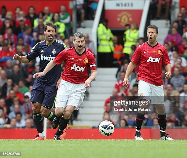 Denis Irwin in action during the Manchester United Foundations Legends match between Manchester United Legends and Real Madrid Legends at Old...